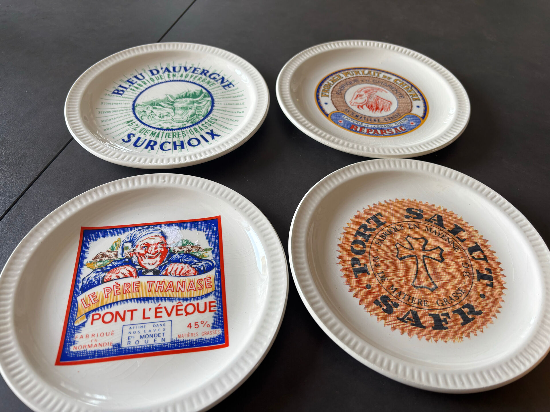 6 ceramic cheese plates from St Armand, France, in their box.