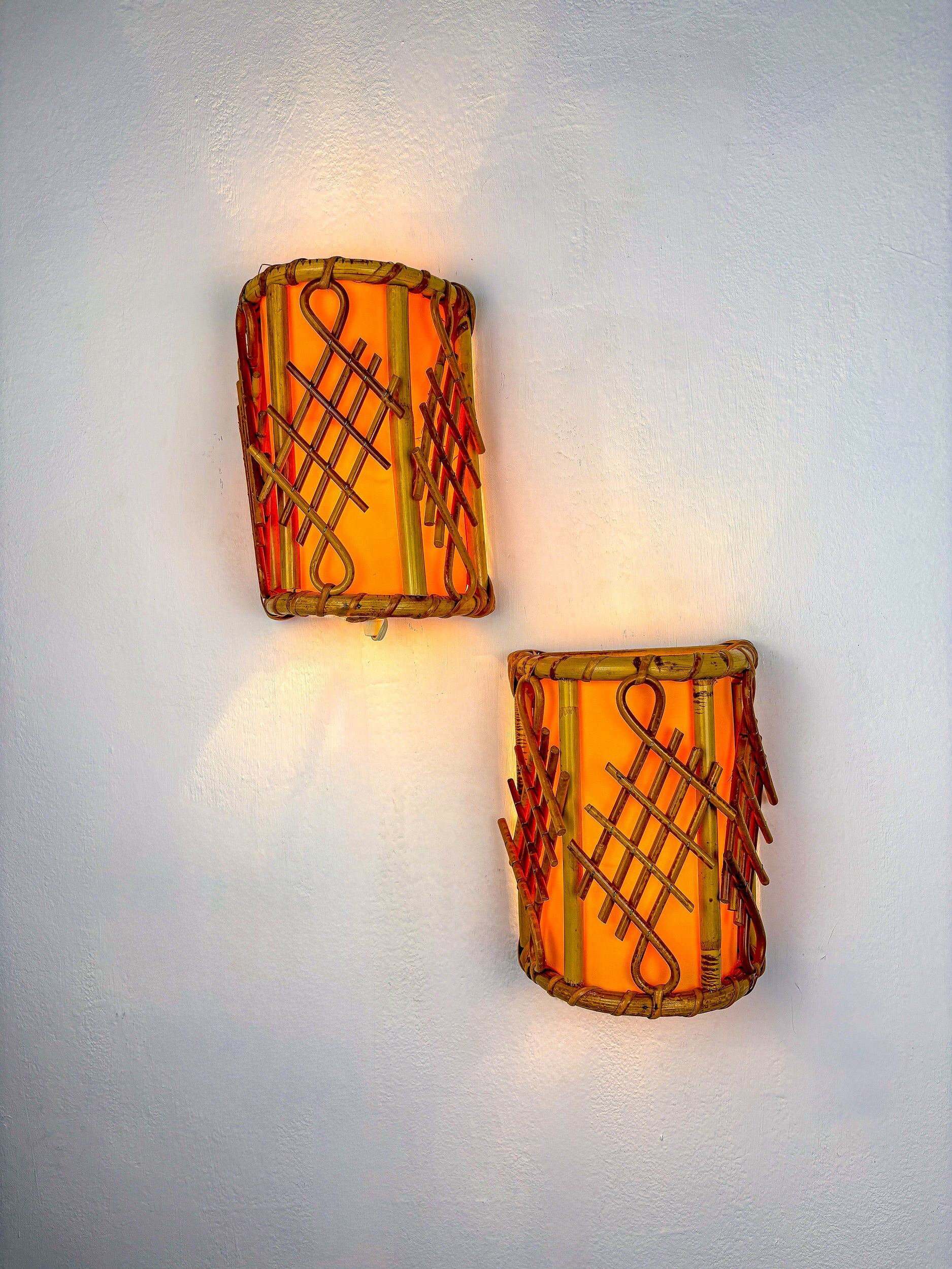 Pair of mid-century rattan wall sconces, circa 1970s, Italy