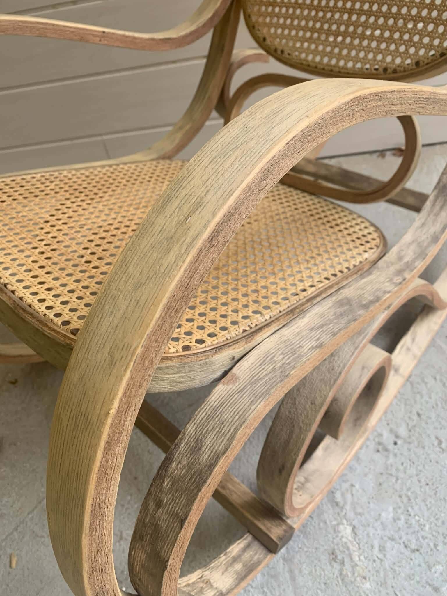 Rocking chair with a cane seat and backrest.