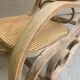 Rocking chair with a cane seat and backrest.