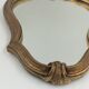 Old mirror in golden resin