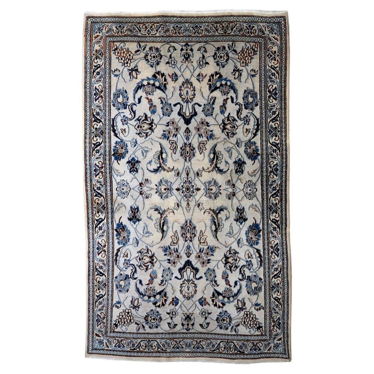1950s hand-knotted wool rug with silk highlights, ivory and blue, 118 × 200 cm