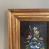 Golden frame with painting bouquet of flowers