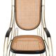 Modernist rocking chair in gilded brass and cane.