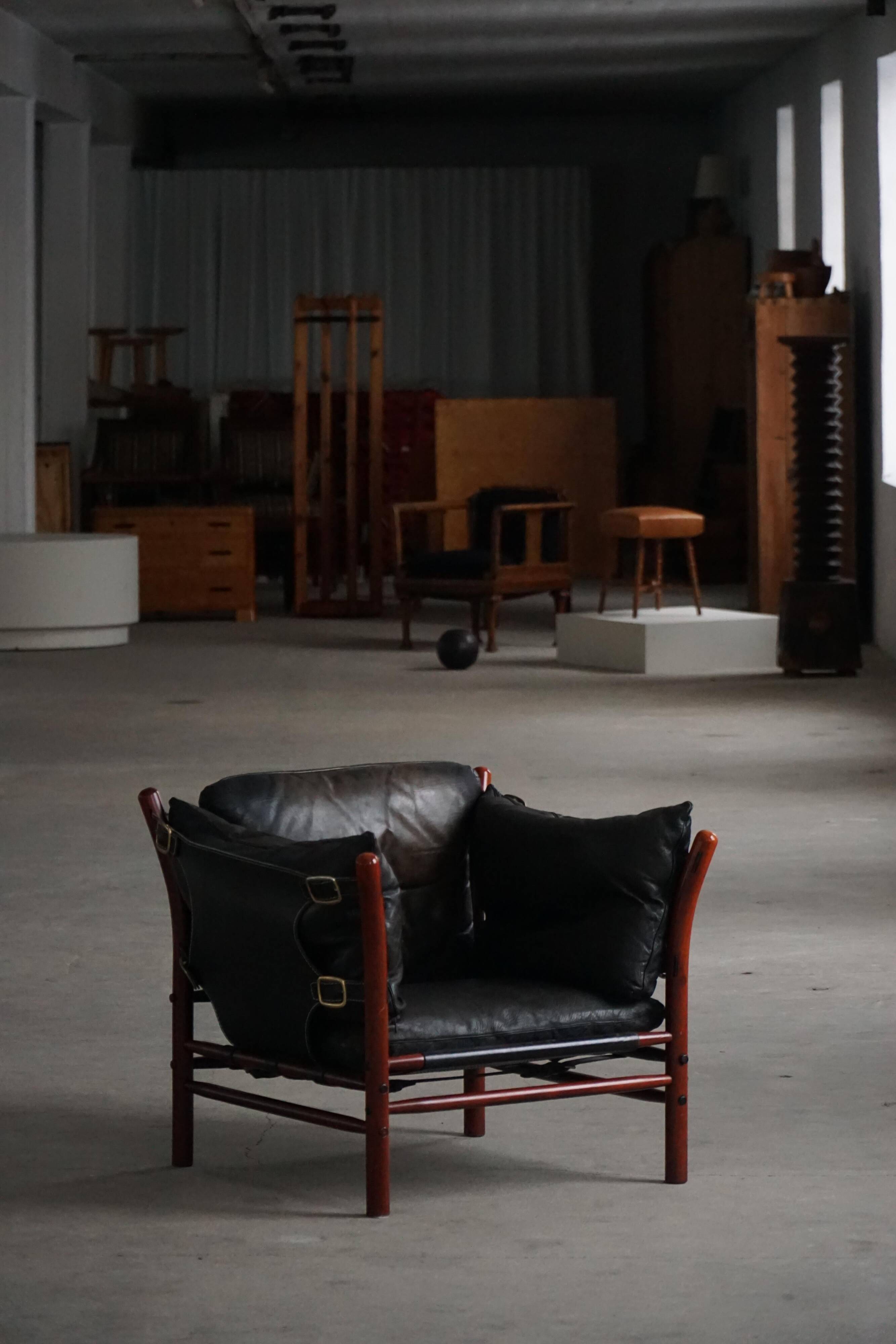 "Lounge chair 'Ilona' by Arne Norell in stained beech and leather, mid-20th century."