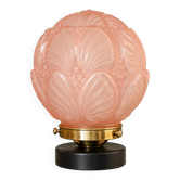 Penelope — Art Deco table lamp in sculpted pink glass, black brass base.