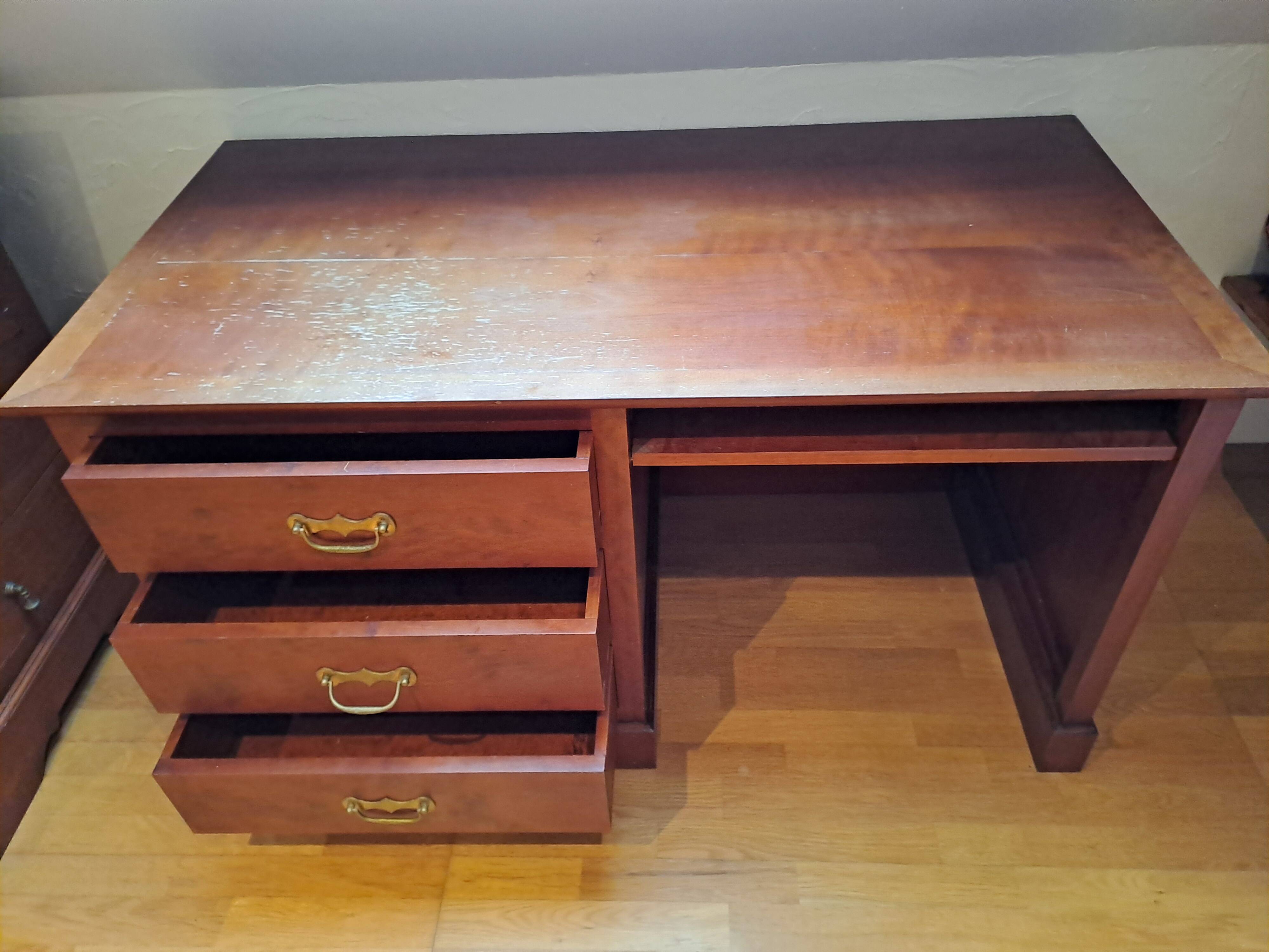 Solid cherry wood desk with 1 block and 3 drawers.