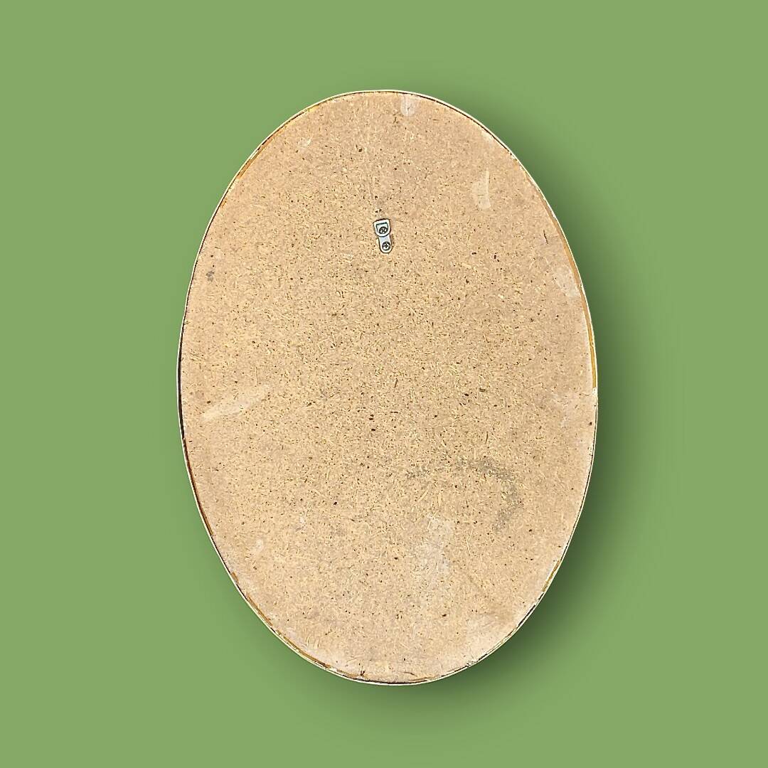 Large antique oval wall mirror in stylized gilt metal, – Hollywood Regency