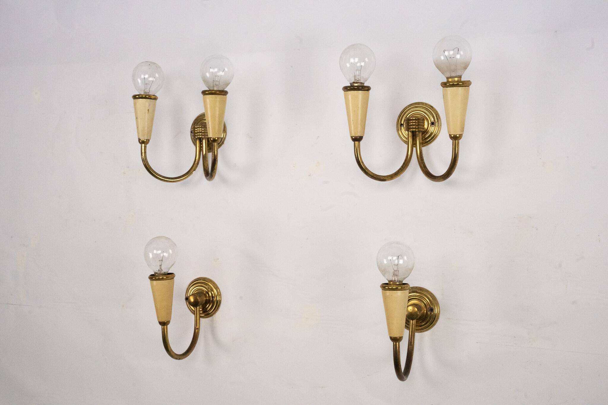Set of four Mid-Century sconces in lacquer and brass. Italy 1950s