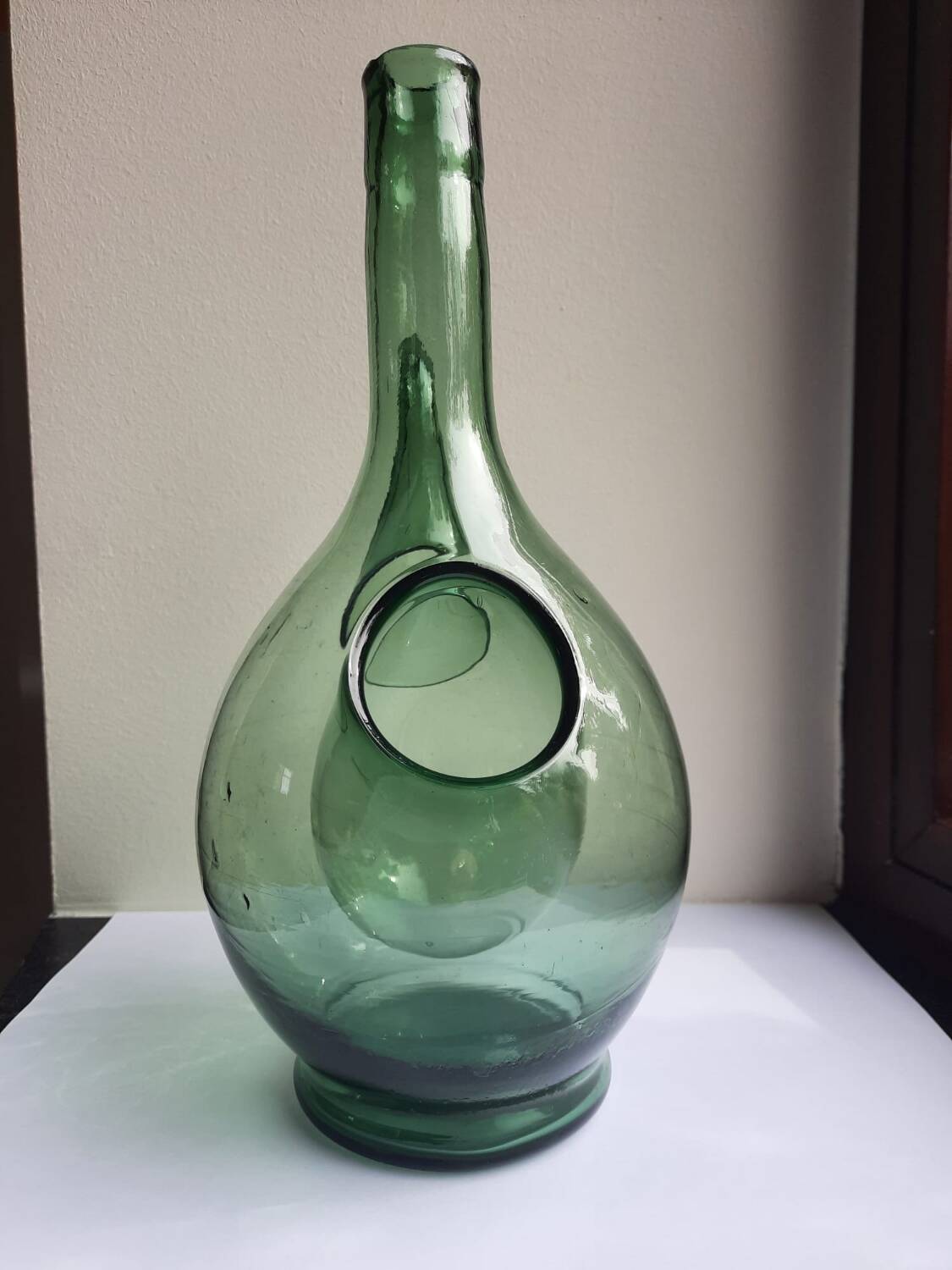 Pair of blown glass wine decanters in blue/green hues.