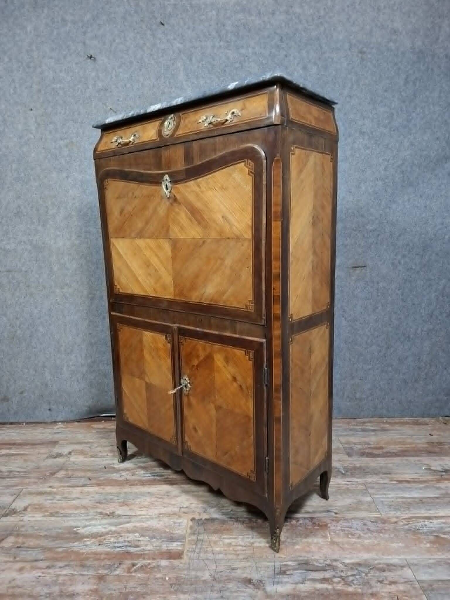 Louis XV period secretary in marquetry and veneer, 18th century.
