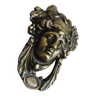 Large antique style brass metal knocker.