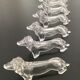 8 porte-couteaux en plastique, années 70, forme teckel