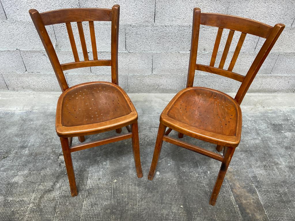 Two vintage curved wooden bistro chairs