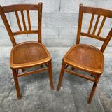 Two vintage curved wooden bistro chairs