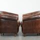 Set of two sheepskin club armchairs with fixed seat cushions