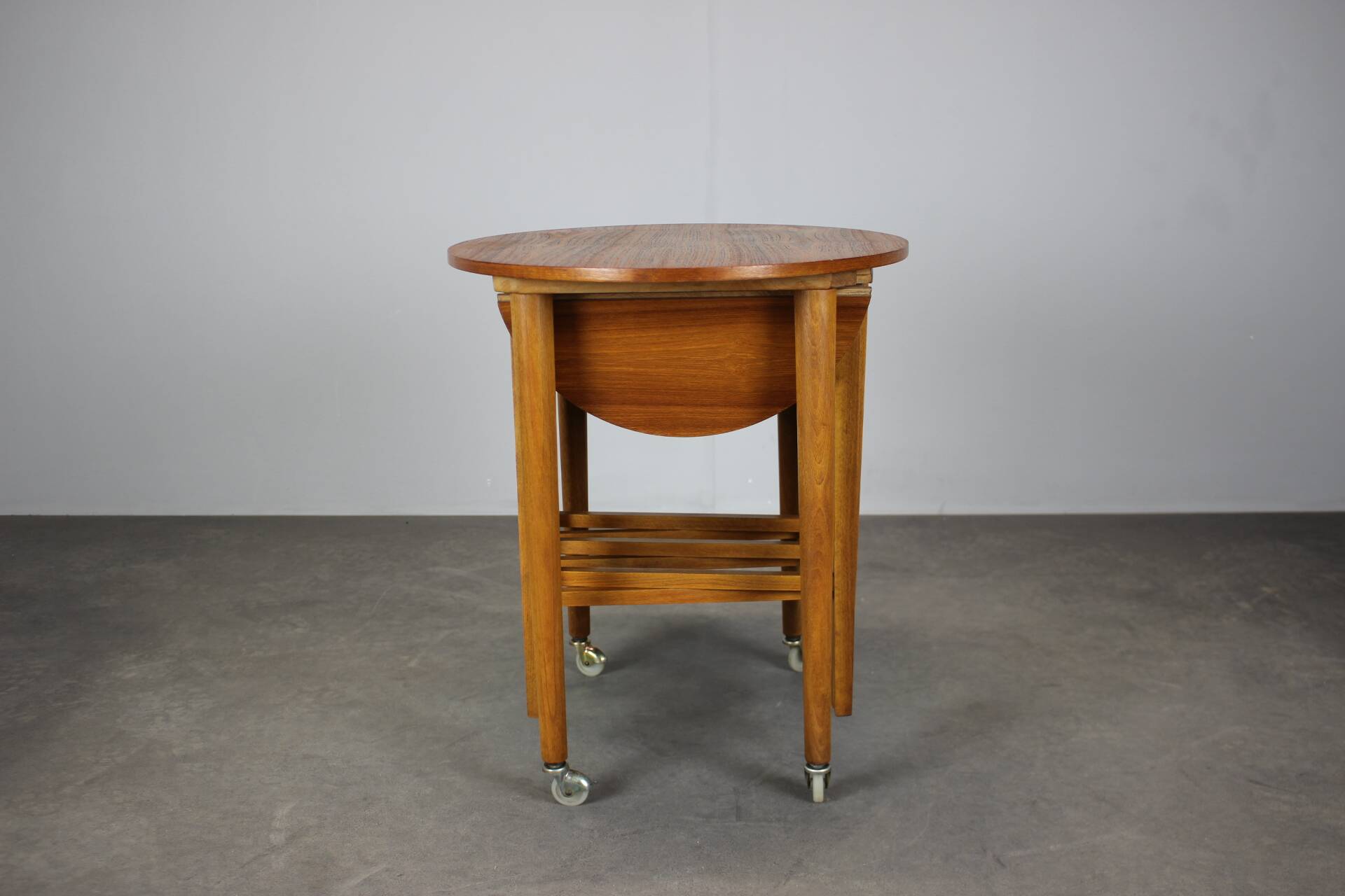 Restored Danish folding teak table with three nesting chairs by Poul Hundevad