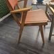 Modernist armchair in wood and orange fabric