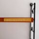 Scandinavian Hylla teak wall shelf with brass label