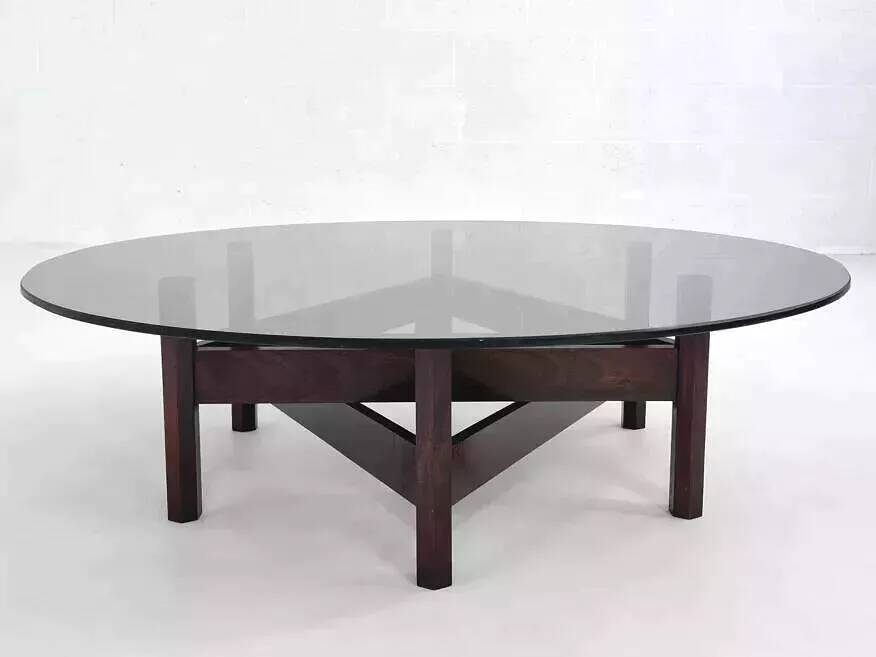 Wooden coffee table with round smoked glass top