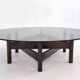 Wooden coffee table with round smoked glass top