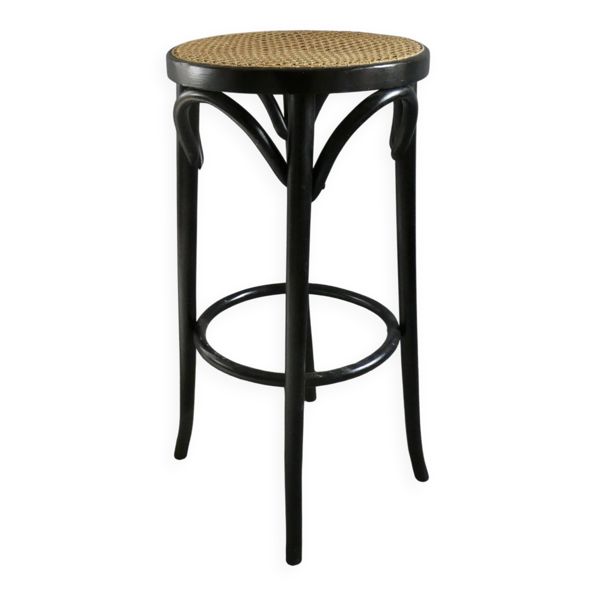 Curved wooden bar stool with a caned seat.
