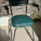 Pair of green vinyl and chrome armchairs, mid-century
