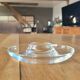 2 egg cups with matching glass cloches in transparent glass