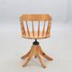 Rotating chair with turned wooden bar, 5-star base, US