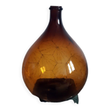 Great old demijohn in amber glass