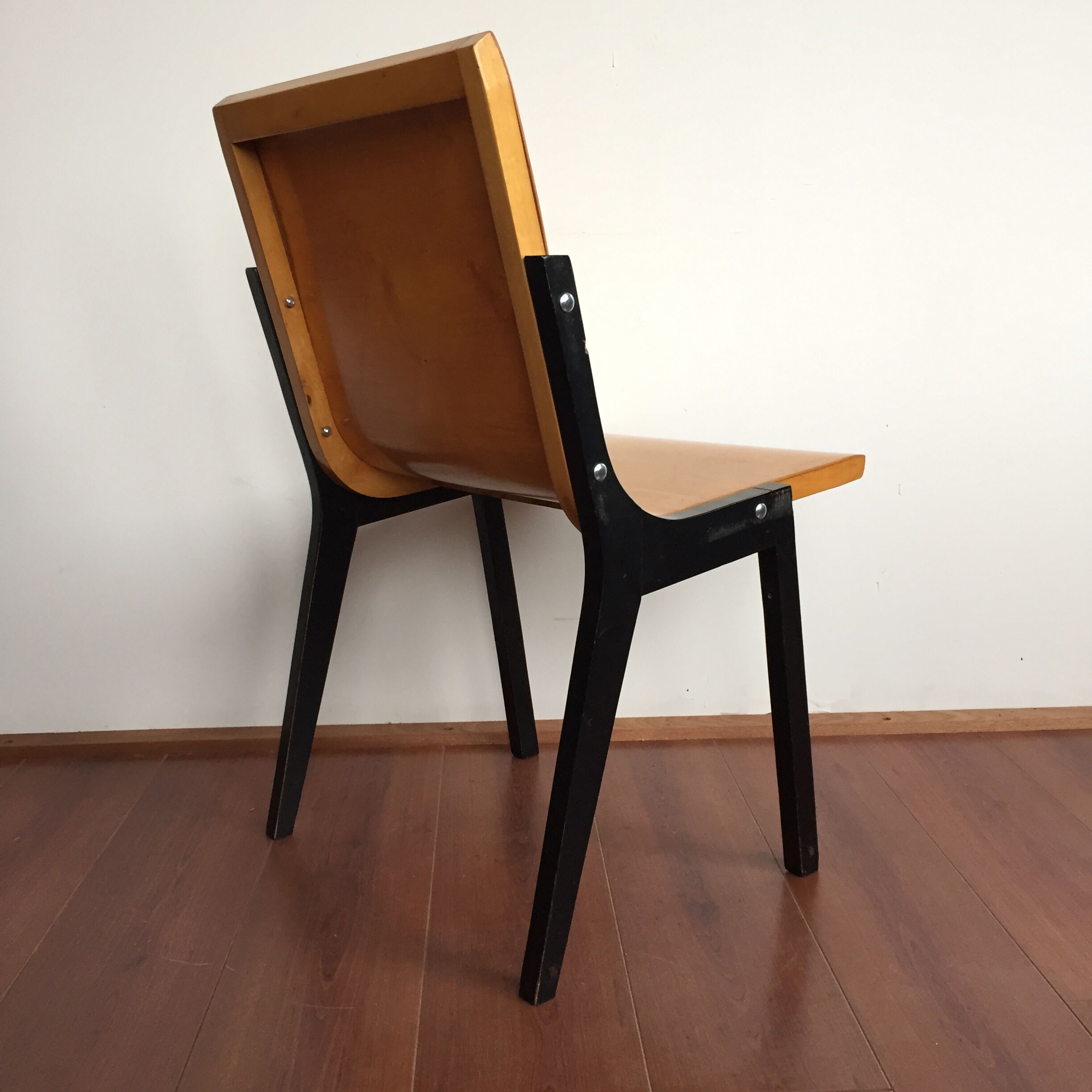 1950s church or school chairs in beech plywood and black stained wood by Roland Rainer