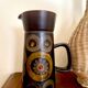 Enamelled ceramic carafe