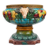 Large neoclassical majolica jardinière with ram's heads.