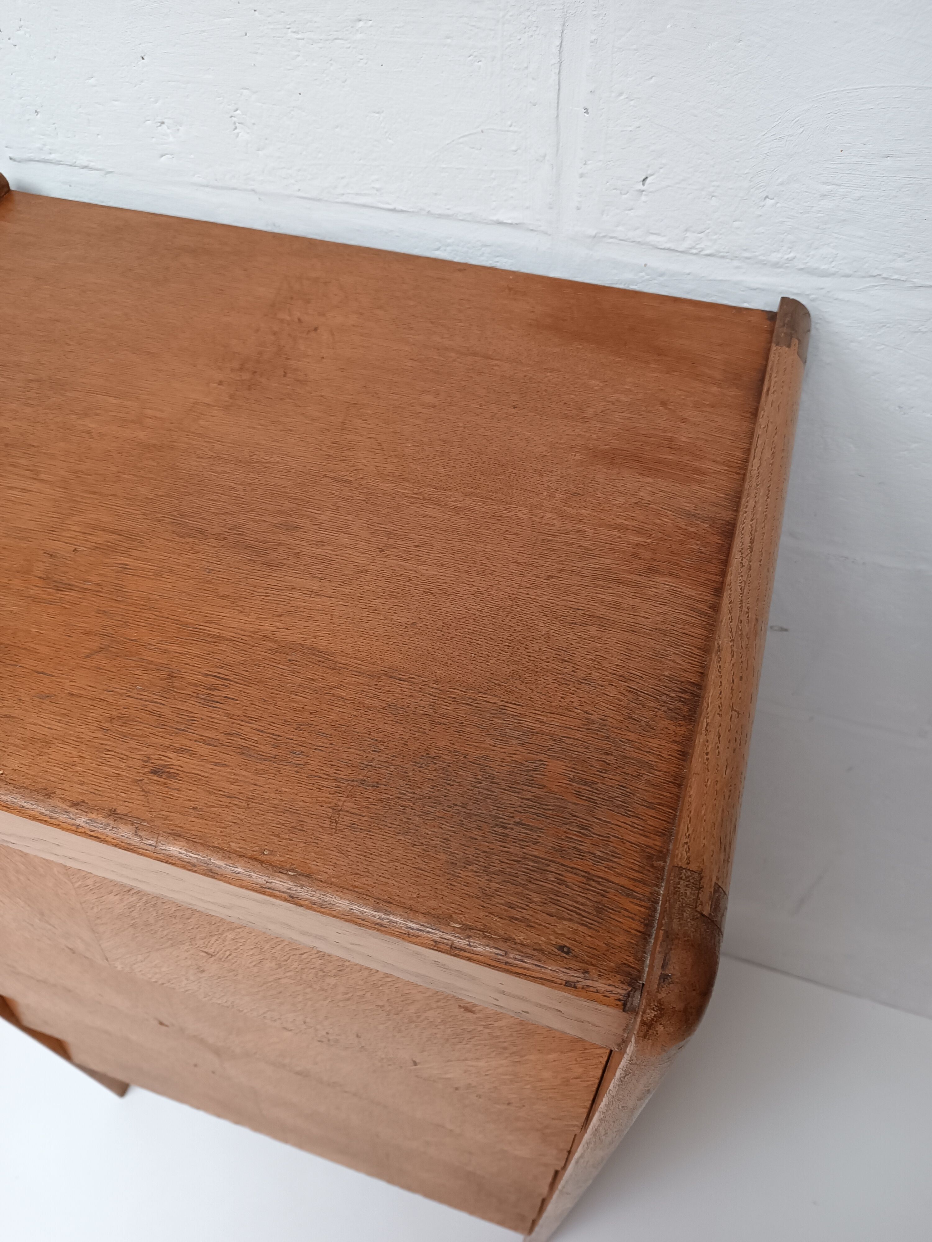High wooden chest of drawers in the 50s
