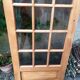 Old wooden door glazed with small tiles