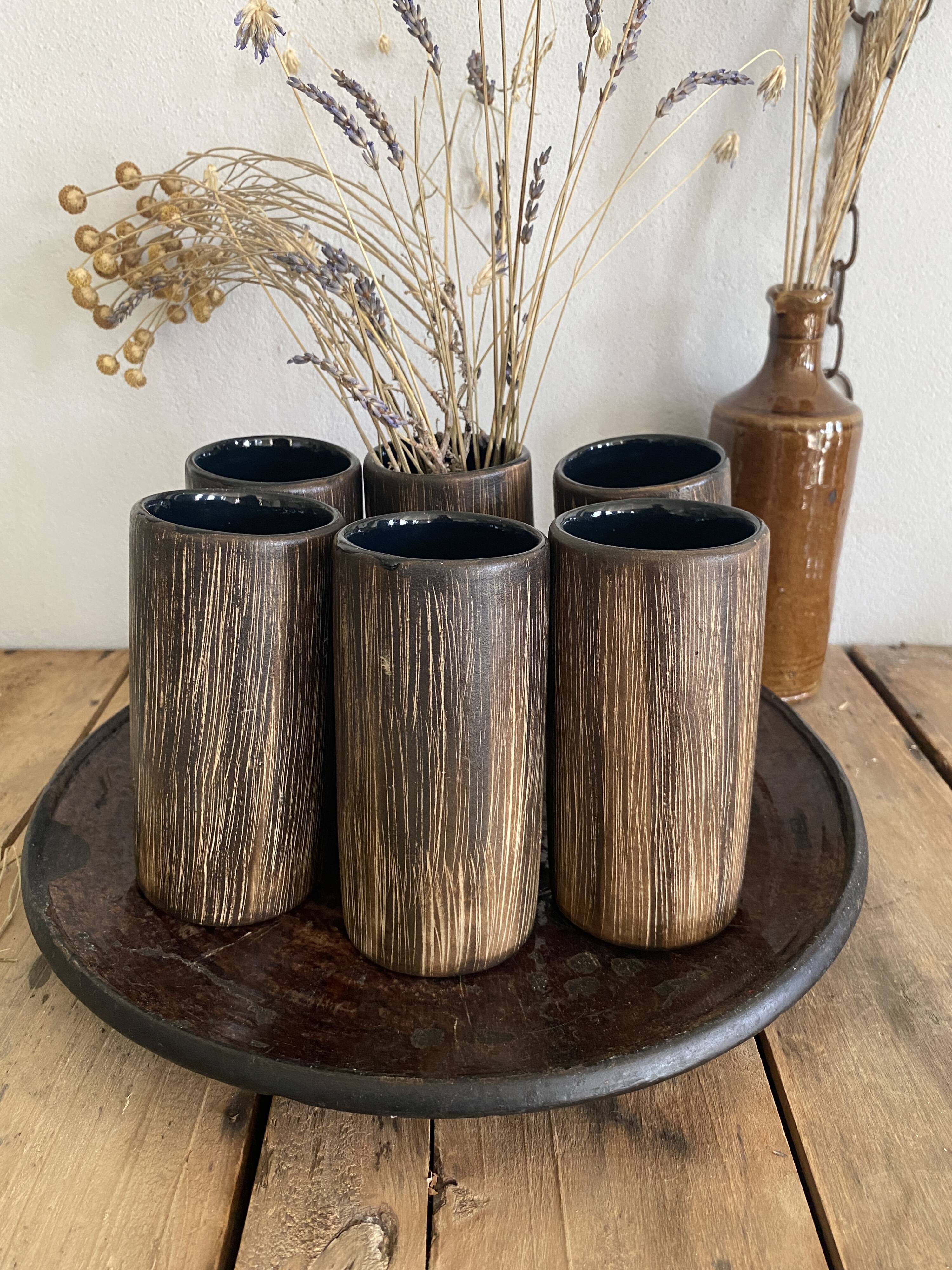 Six terracotta glasses, matt and glazed