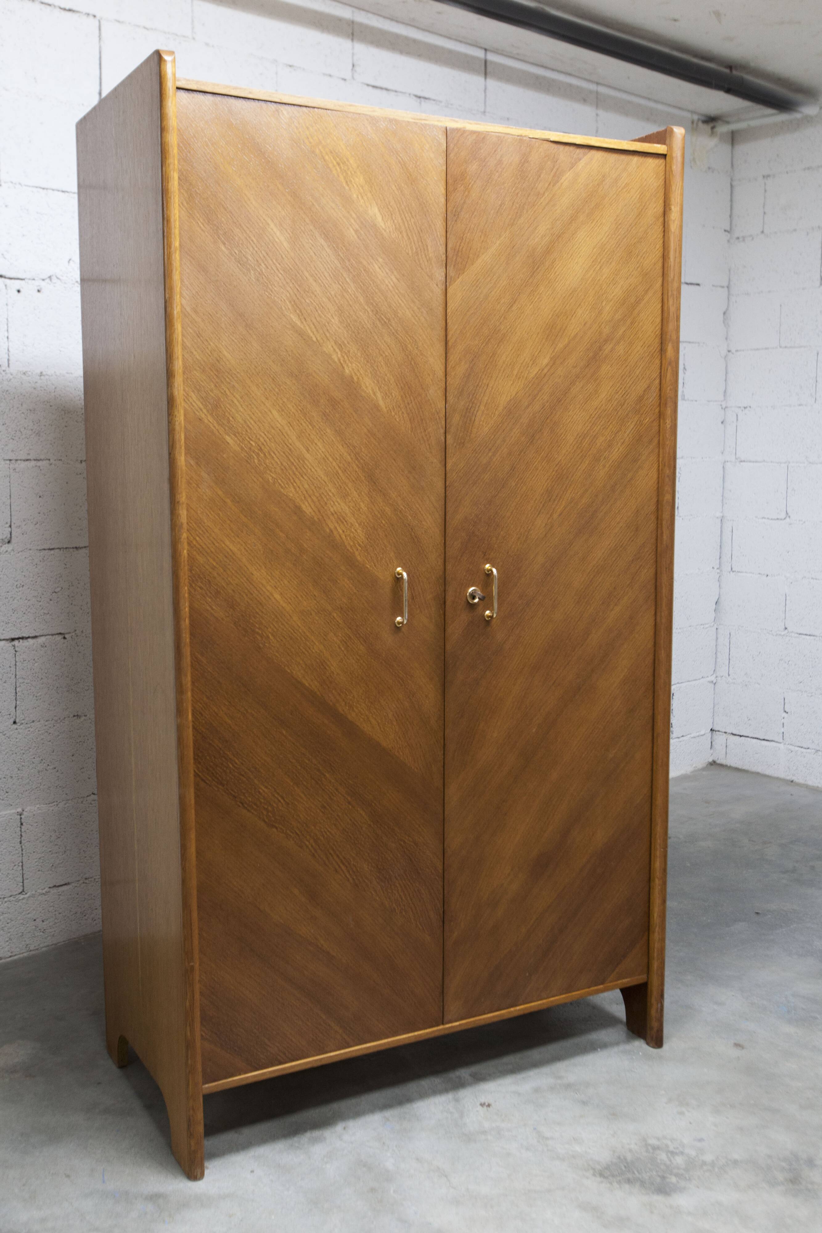 1950s Mid-Century Modern oak armoire with two doors and two drawers.