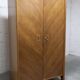 1950s Mid-Century Modern oak armoire with two doors and two drawers.