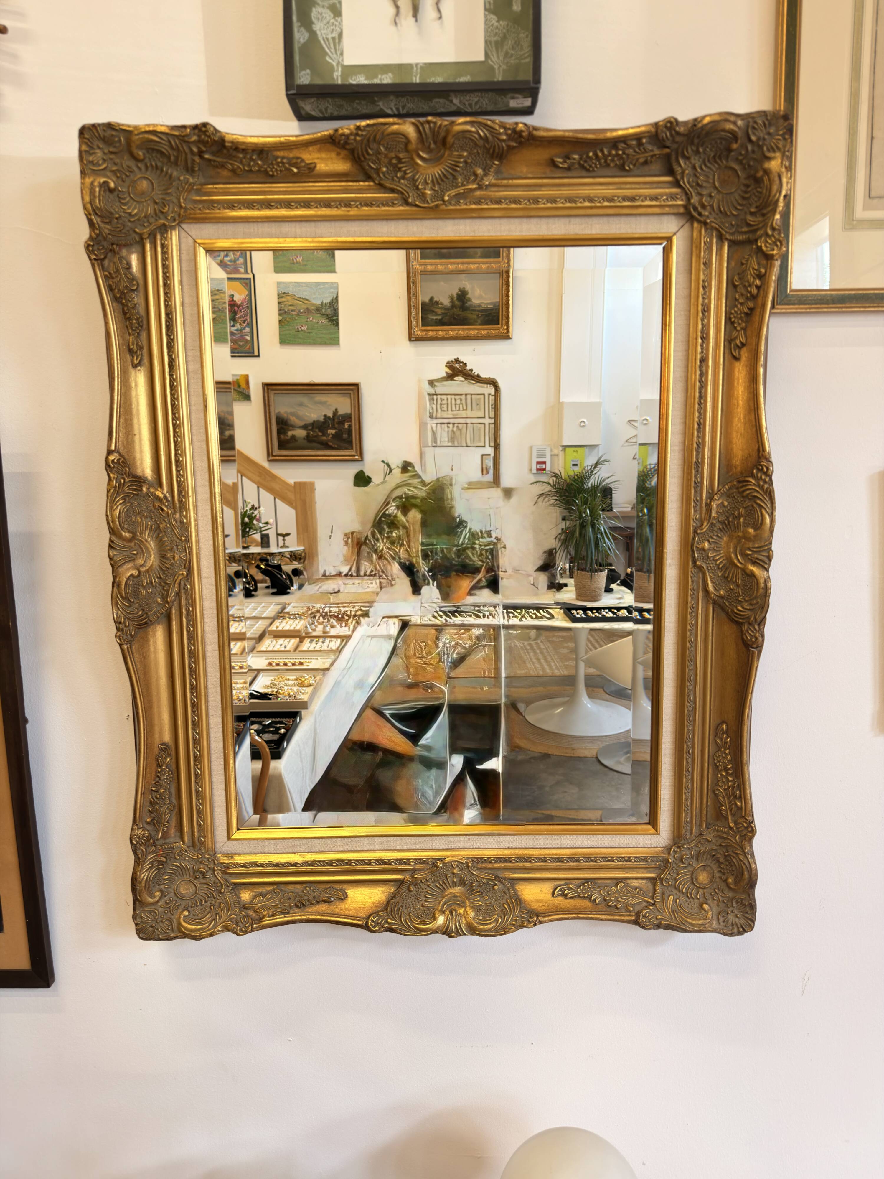 Golden wooden mirror in Louis XV style