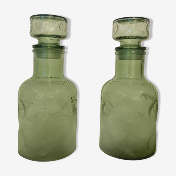 Set of two vintage glass decanters with caps