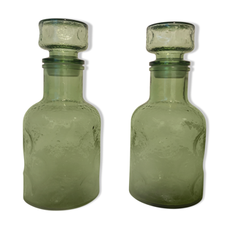 Set of two vintage glass decanters with caps