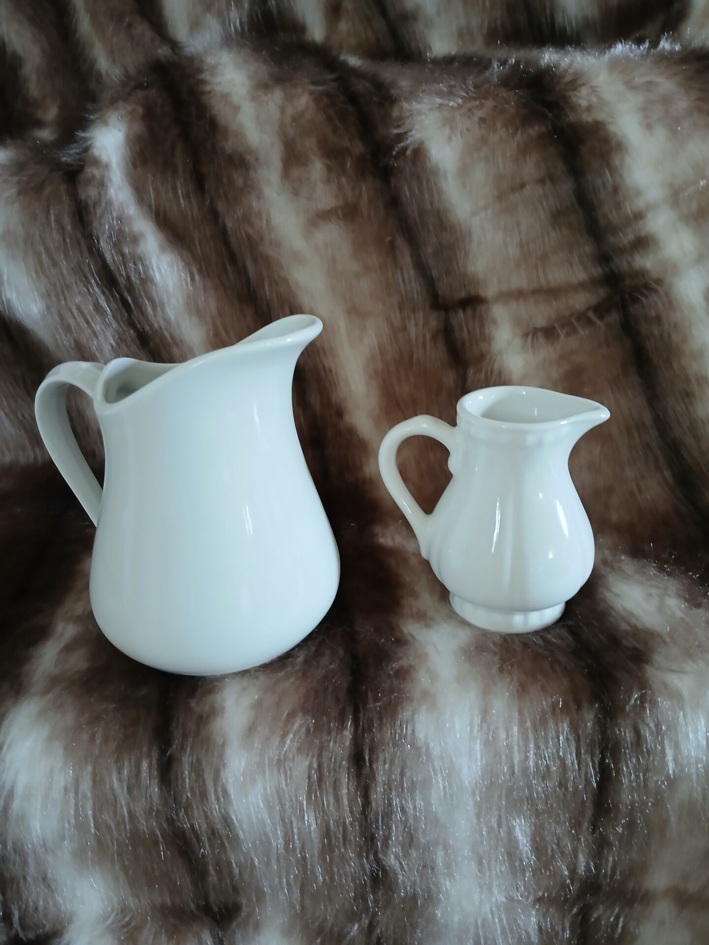 2 antique pitchers in white earthenware