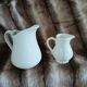 2 antique pitchers in white earthenware