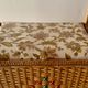 Large vintage rattan and wicker sewing basket with floral decor seat