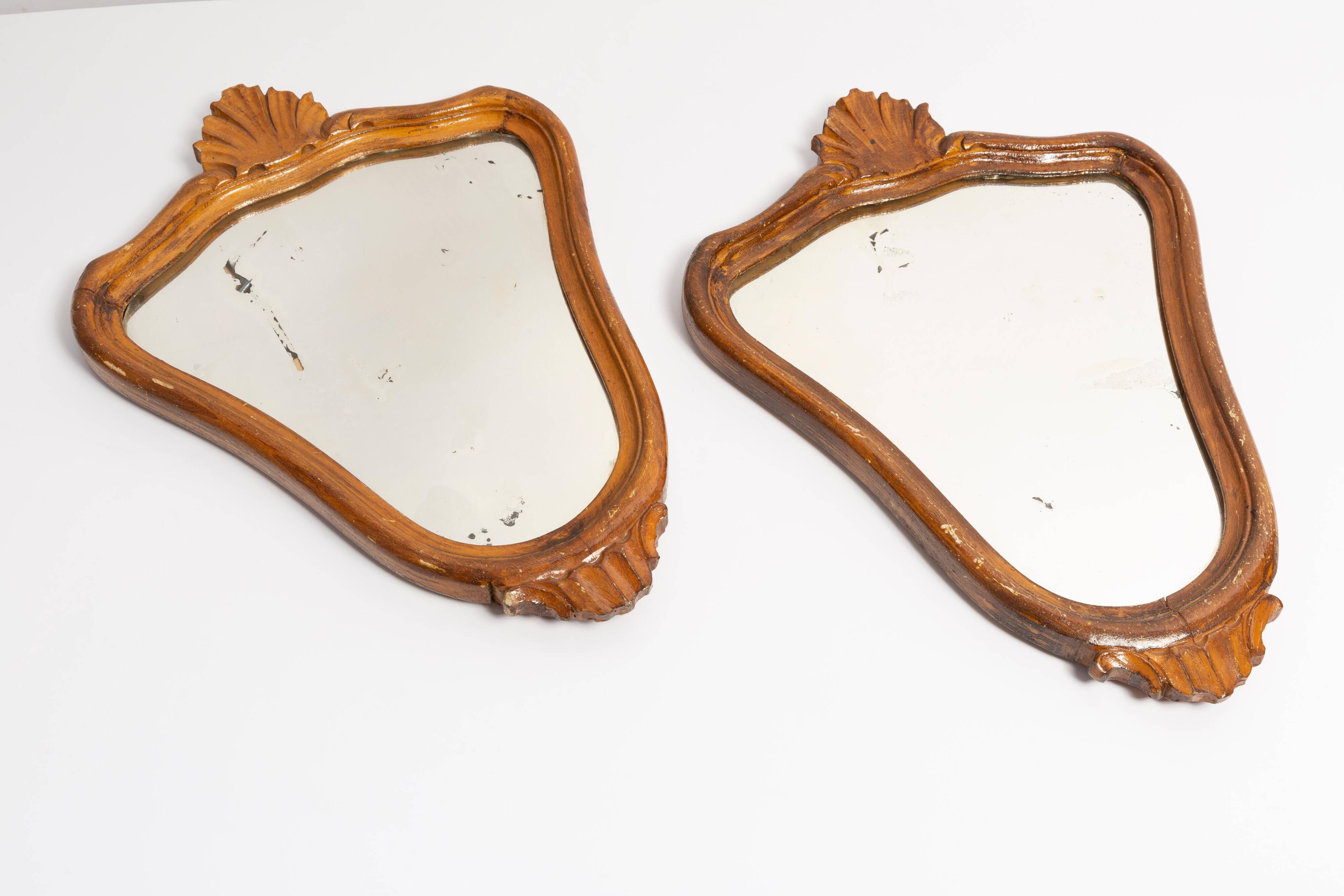 Pair of vintage Mid-Century decorative mirrors in a gold frame, Italy, 1960s.