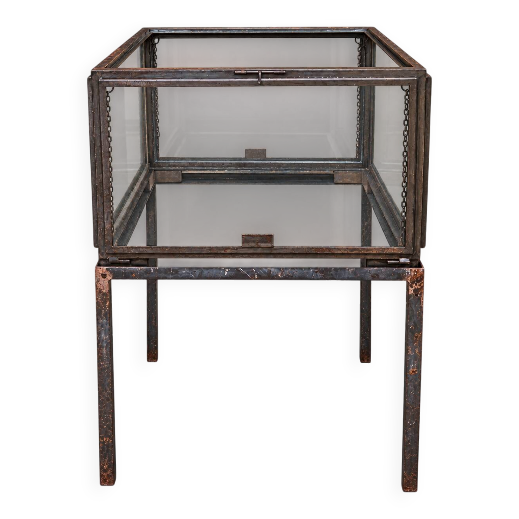 A showcase made of steel and glass, mounted on a custom-made steel base.