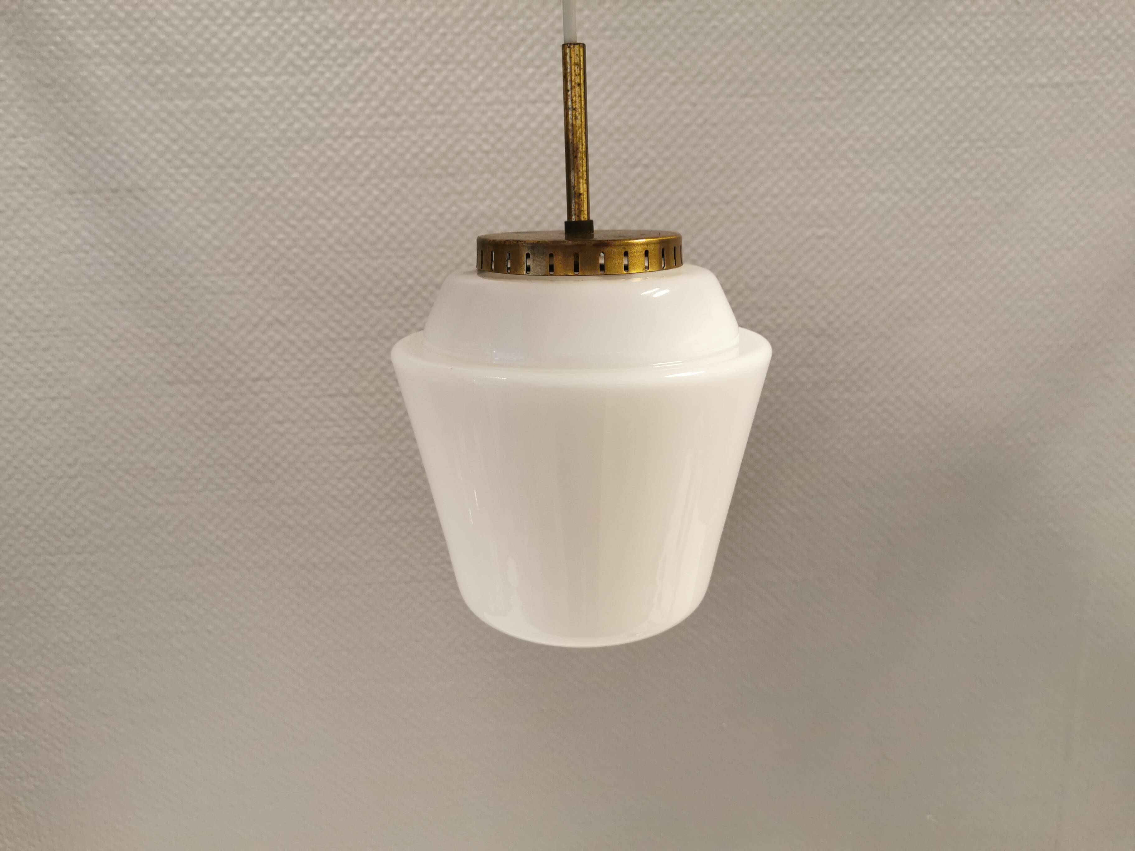 Hanging lamp in red lacquered metal and milky white opal glass 1970s Denmark.