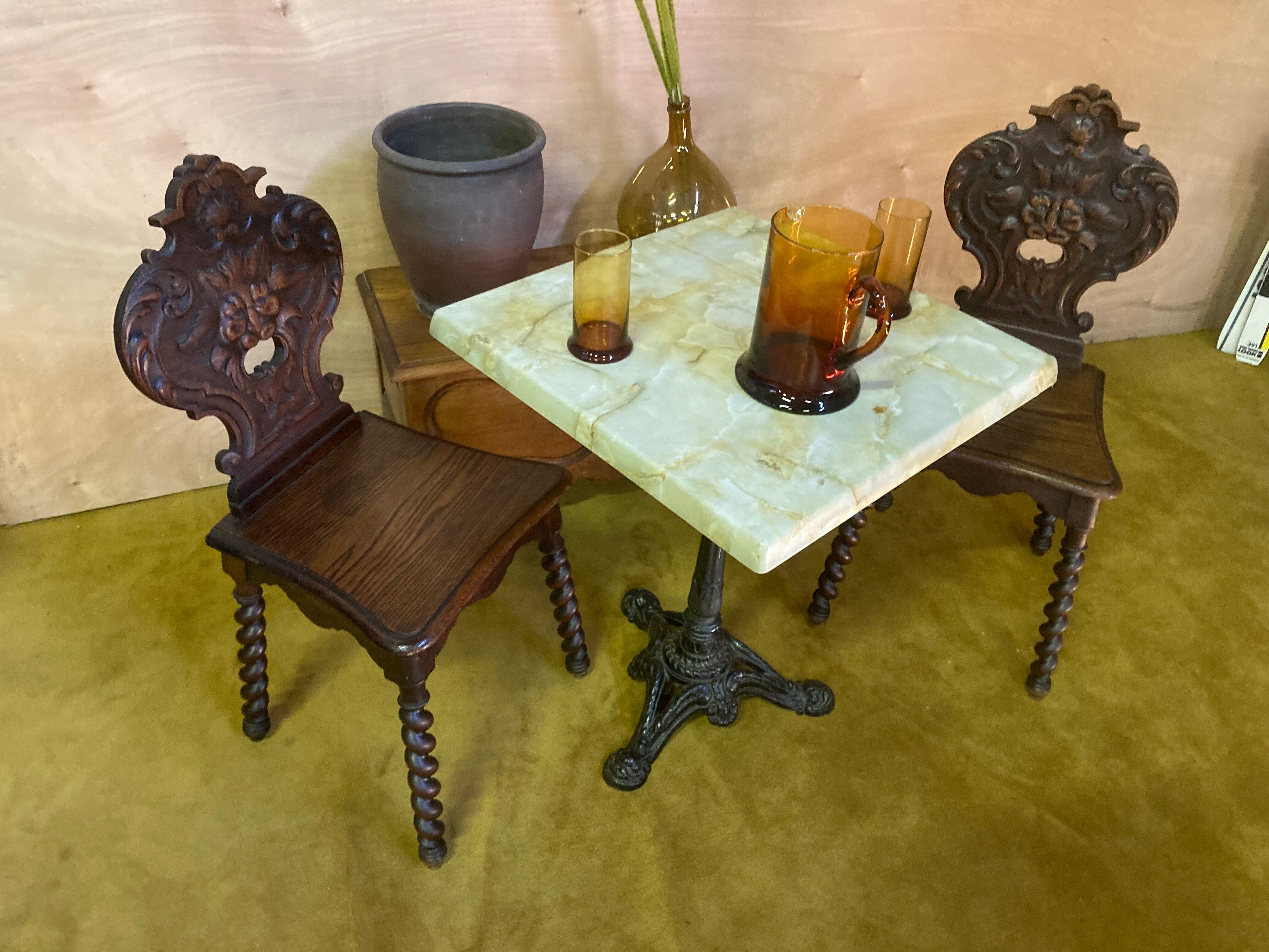 Duo of carved wooden chairs