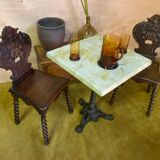 Duo of carved wooden chairs