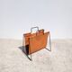 Magazine rack in tan leather and black metal